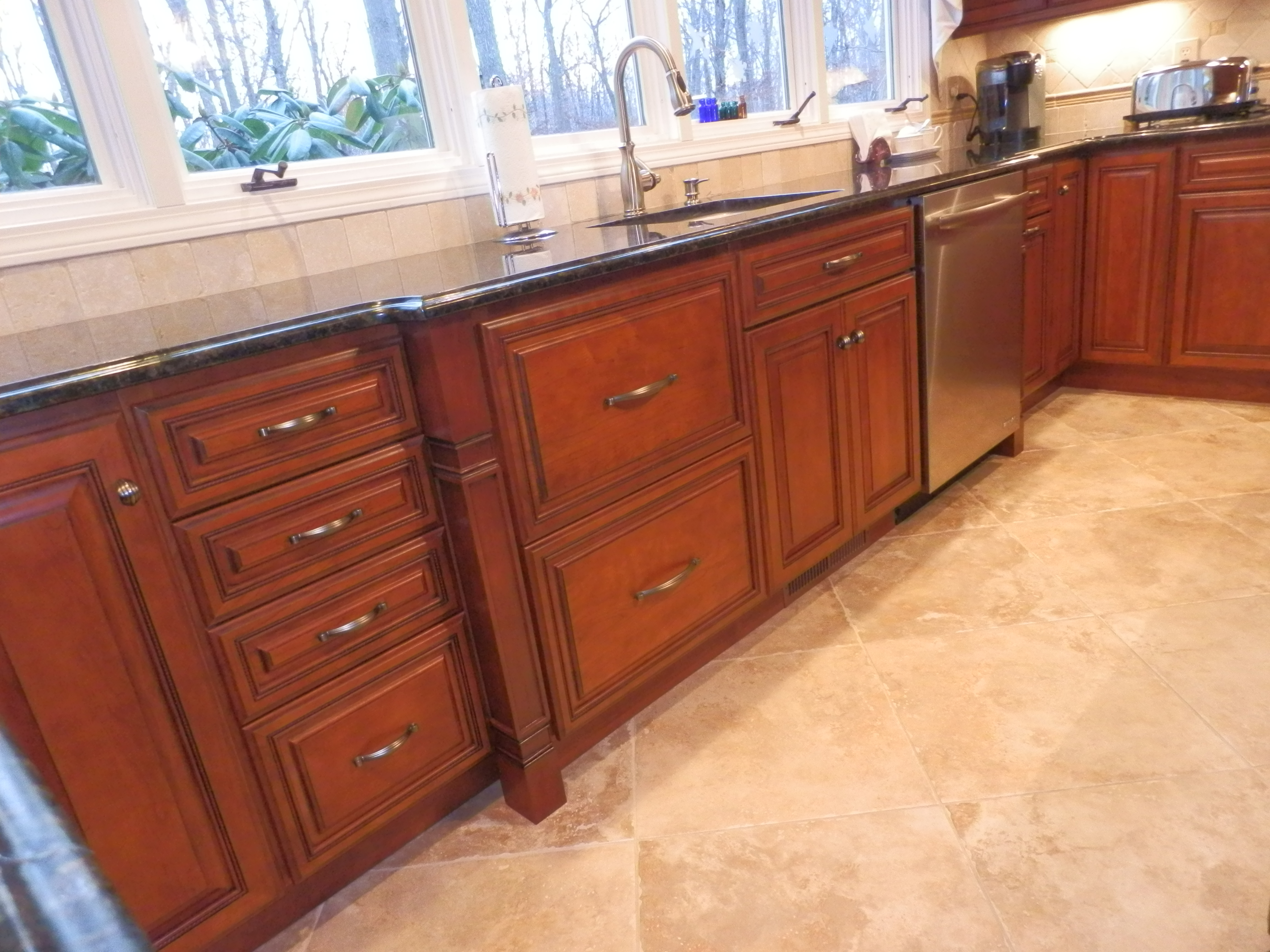 Traditional look of raised panel cherry Kitchen Design Center